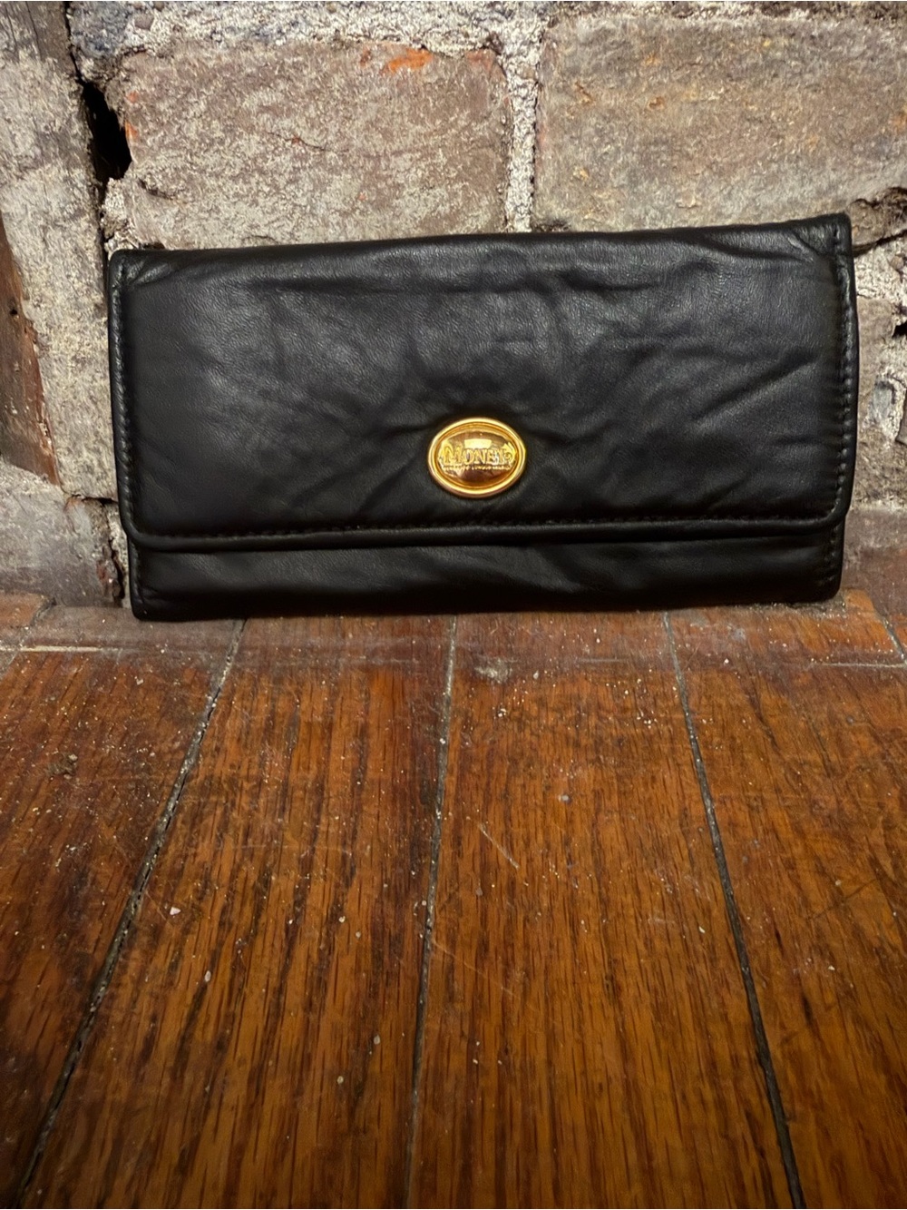 Monet Black Fold-Over Clutch with Gold Logo Accent